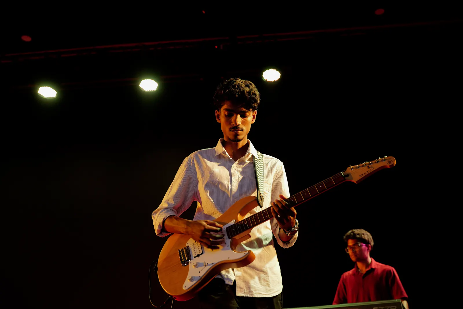 Playing electric guitar on stage